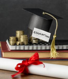 Graduation cap beside stacks of coins representing university education funding.